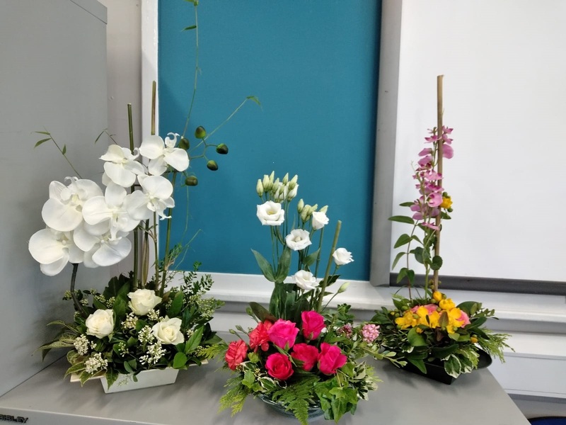A collection of flower arrangements on a table