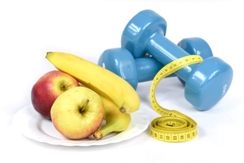 Photograph of fruit, tape measure and free weights