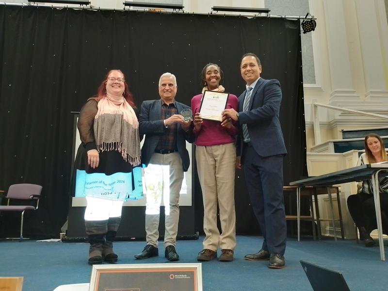 Group of people receiving an award