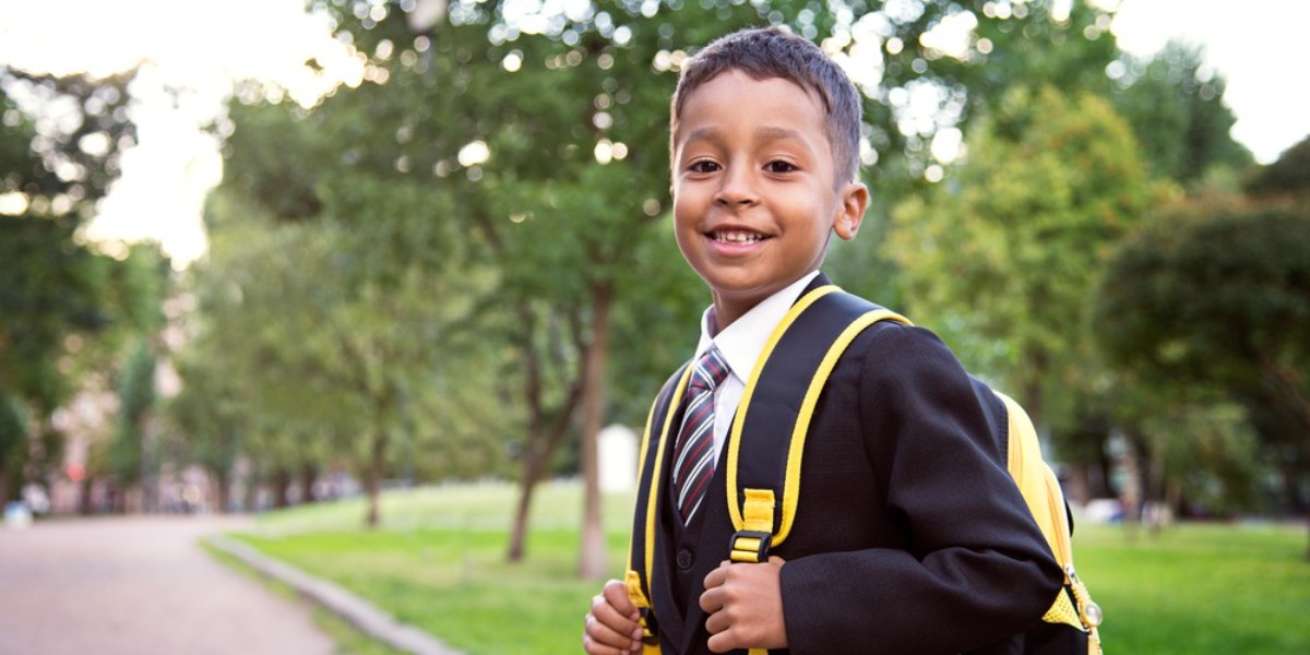child in school uniform 