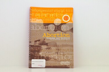 Black and orange book titled Abortion-dilemmas and  decisions