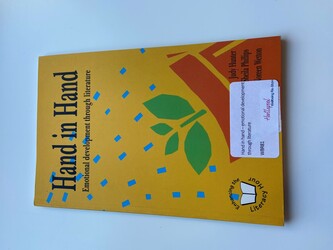 Yellow book cover with a cartoon plant with water particles 