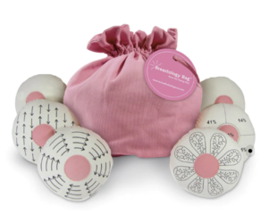 Pink drawstring bag with size individual models to demonstrate frequent lumps found. 