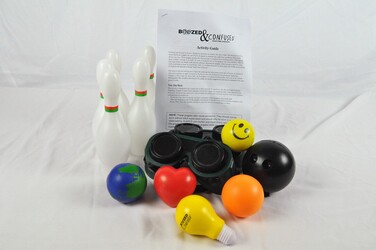 Contents of boozed & confused game - goggles and pins.