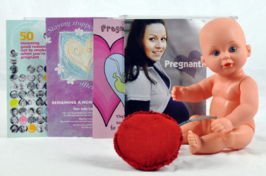 baby with a umbilicus and placenta clip to show the effects of mum's smoking on the babies oxygen levels. 