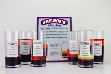 six glasses which are labelled with calories