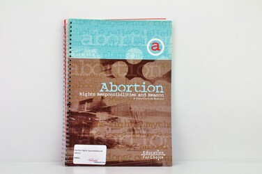 Brown and blue information booklet titled abortion- Right’s responsibilities and reason
