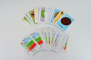 Colourful cards displaying a variety of foods, shows alternative side with facts about the food 