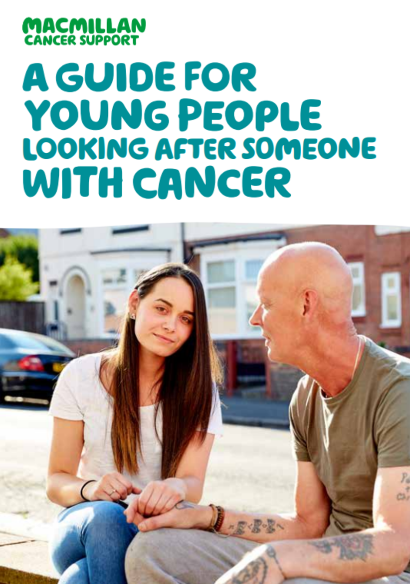 A young person with a man sat down outside, the man is supporting the younger person