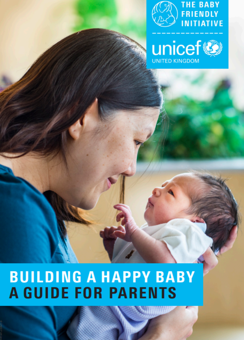 Leaflet cover shows a new mother holding her baby titled Building a happy baby- a guide for parents. 