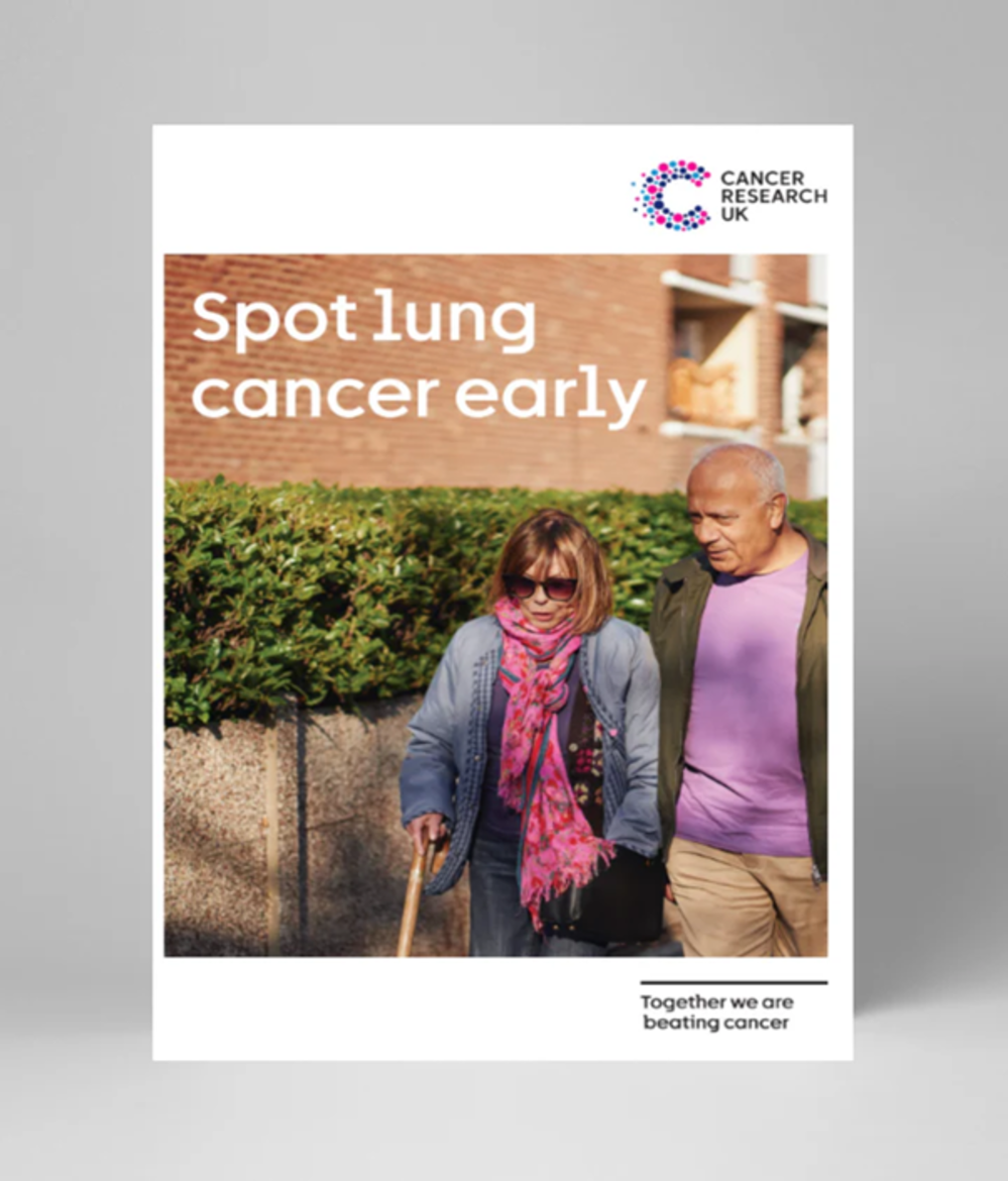 Man and woman walking, woman using a walking stick 