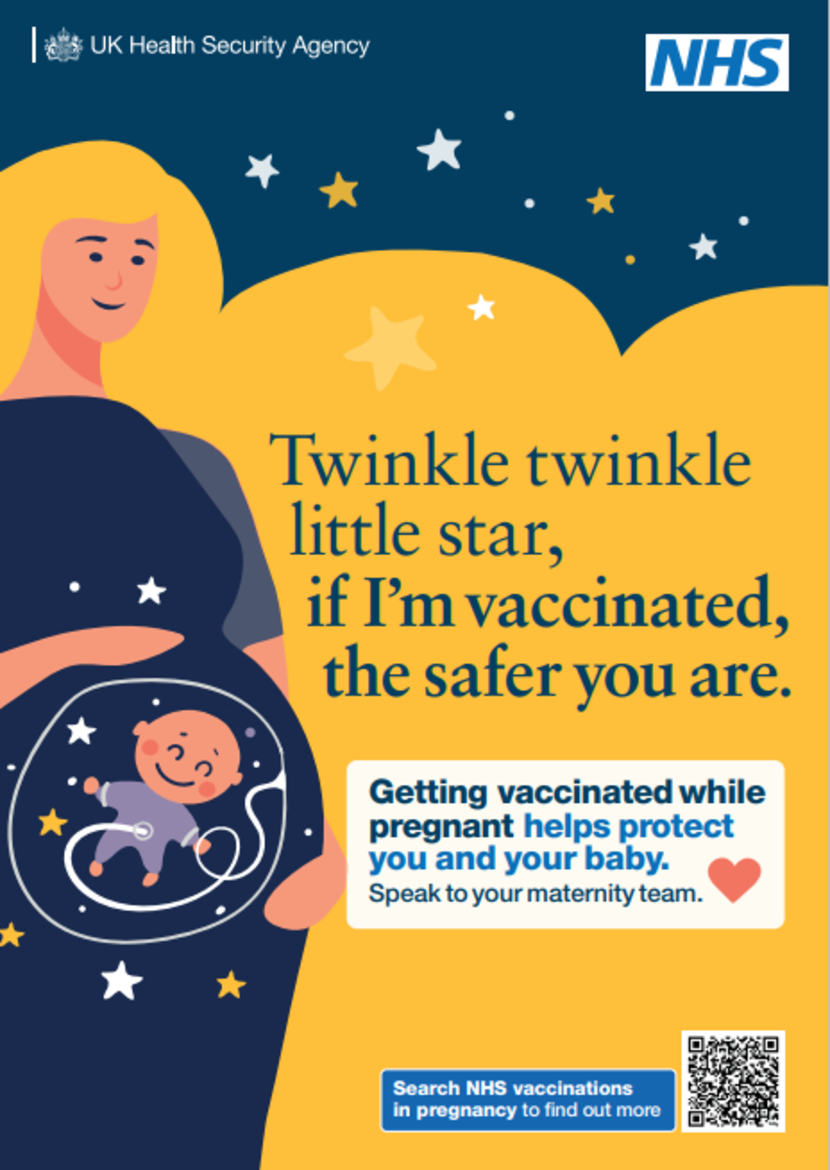 A pregnant person holding a baby